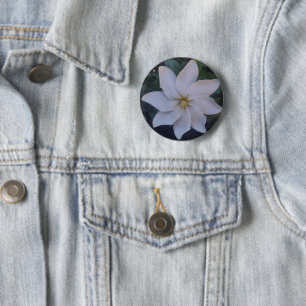 white flower on button