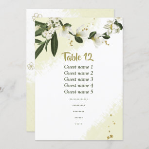 white flowers greenery seating chart table number