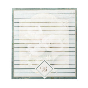 White flowers on green notepad