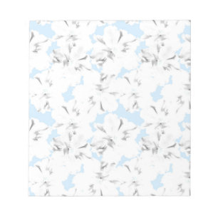 White flowers on light blue. notepad