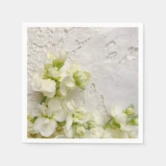 White flowers on old lace napkin