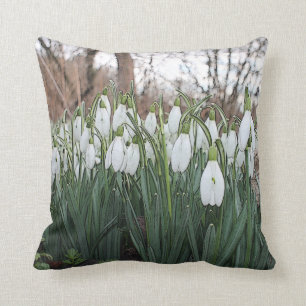 White flowers, spring snowdrops throw pillow