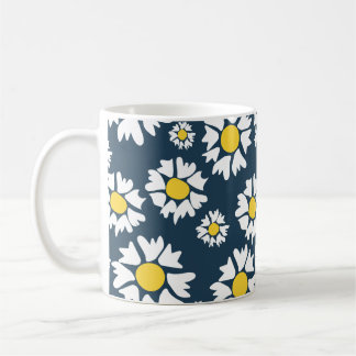 White flowers, yellow centre, on blue background coffee mug