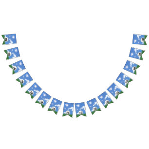 white golf ball in grass for 70th birthday party bunting flags