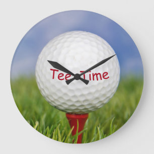 white golf ball on red tee large clock