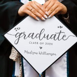 White Grey Simple Modern Elegant Script Hearts Graduation Cap Topper<br><div class="desc">Your favourite grad will stand out and make a statement when they wear this graduation cap topper! Let them celebrate their milestone with this girly, stunning, simple, modern, custom graduation keepsake. A fun, playful visual of soft grey script handwriting and cute, playful hearts, along with her name and class year,...</div>