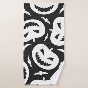 White halloween pumpkins and bats isolated on blac bath towel