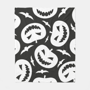 White halloween pumpkins and bats isolated on blac fleece blanket