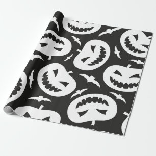 White halloween pumpkins and bats isolated on blac wrapping paper