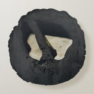 White heart shaped on black surface round pillow