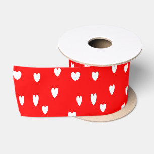 White hearts on red satin ribbon