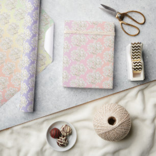 White Hydrangea Blossoms On Rainbow Wrapping Paper