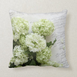 white hydrangeas with script writing pillow