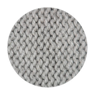 White knitted wool texture, close-up photo. cutting board