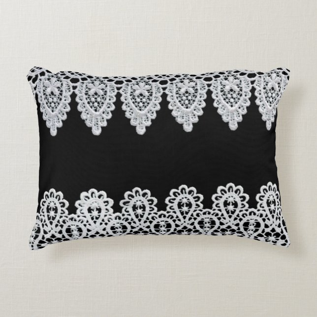 White lace forms a delicate border against black accent pillow (Front)