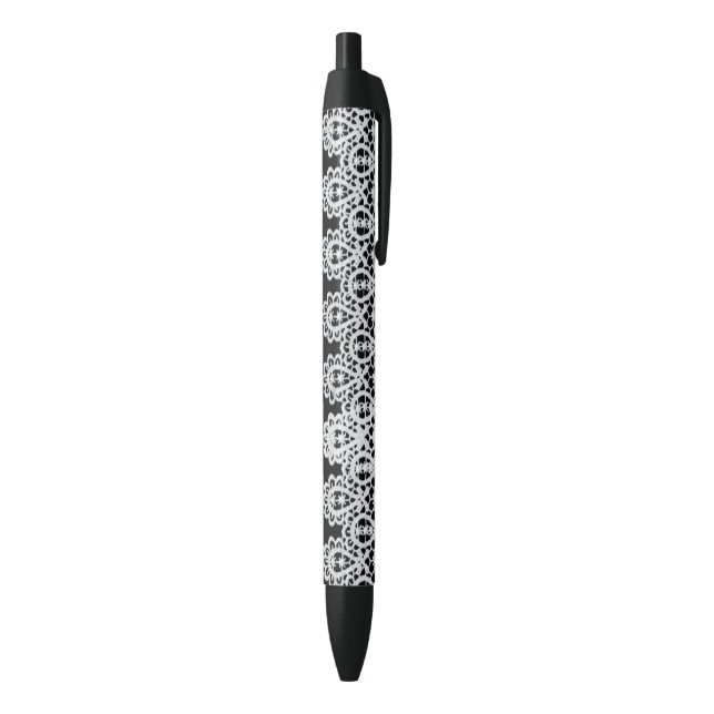 White lace forms a delicate border against black ink pen (Bottom (Vertical))