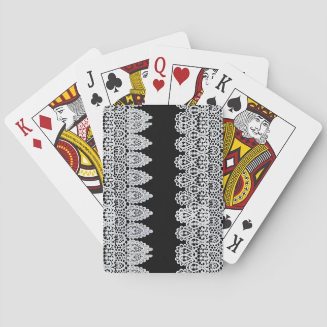 White lace forms a delicate border against black playing cards (Back)