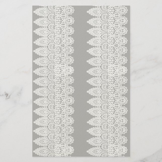 White lace forms a delicate border against black stationery (Front)