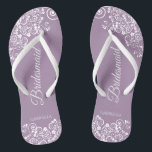 White Lace on Dusty Purple Bridesmaid Wedding Flip Flops<br><div class="desc">These beautiful wedding flip flops are a great way to thank and recognize your bridesmaids while saving their feet at the same time. Features an elegant design with white floral lace filigree on a dusty purple, lilac, or lavender coloured background. The elegant script lettering reads Bridesmaid with her name below....</div>
