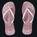 White Lace on Dusty Rose Bridesmaid Wedding Flip Flops<br><div class="desc">These beautiful wedding flip flops are a great way to thank and recognize your bridesmaids while saving their feet at the same time. Features a simple yet elegant design with white floral lace filigree on a dusty rose or mauve pink coloured background. The elegant script lettering reads Bridesmaid with her...</div>