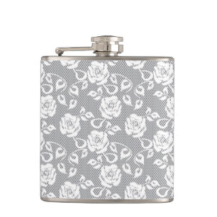 White lace pattern on grey background hip flask