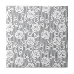 White lace pattern on grey background tile