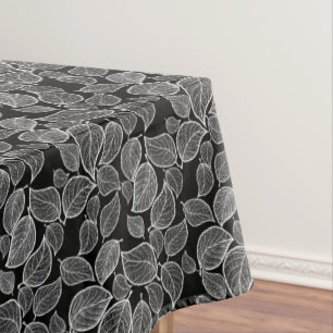 White Leaves on Black Tablecloth