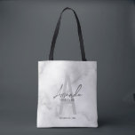 White Marble Script Personalized Bridesmaid's Name Tote Bag<br><div class="desc">Modern Minimalist Personalized Monogram and Name Gifts This design features personalized bridesmaid's name in grey modern handwriting script font style and monogram in light grey modern sans serif font style as background, with wedding details in grey modern sans serif font style, on white marble background. Also perfect for maid of...</div>