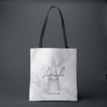 White Marble Script Personalized Bridesmaid's Name Tote Bag<br><div class="desc">Modern Minimalist Personalized Monogram and Name Gifts This design features personalized bridesmaid's name in grey modern handwriting script font style and monogram in light grey modern sans serif font style as background, with wedding details in grey modern sans serif font style, on white marble background. Also perfect for maid of...</div>