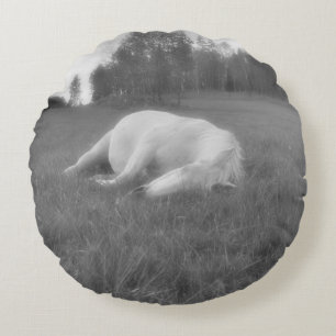 White Mare Resting in Field on a Horse Ranch Round Pillow