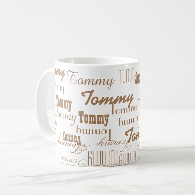 white mug with light brown pattern of name (Front Left)