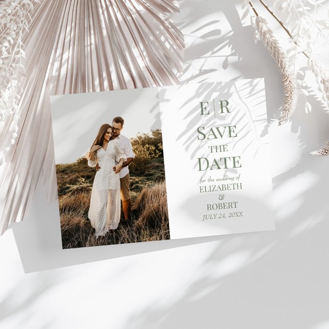 White & Olive Monogram Photo Save the Date Card (Minimalist Olive Monogram Photo Save the Date Card on a sunny white table with dry botanicals.)
