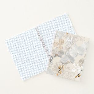 White orchids on a light cream  notebook