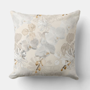 White orchids on a light cream throw pillow