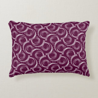 White ornament on a burgundy background. accent pillow