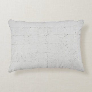White painted concrete wall concrete accent pillow