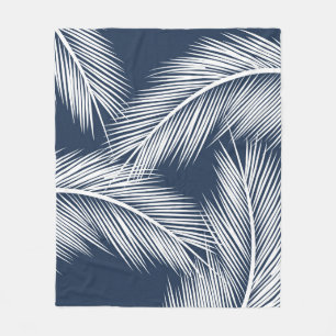 White palm leaves on dark blue colour background fleece blanket