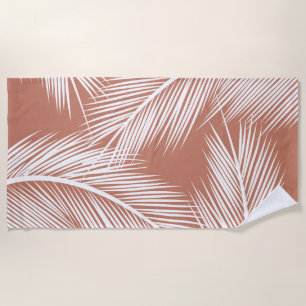 White palm leaves on terracotta colour background beach towel