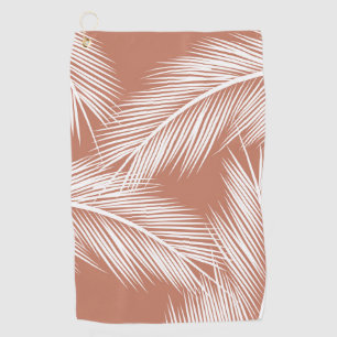 White palm leaves on terracotta colour background golf towel