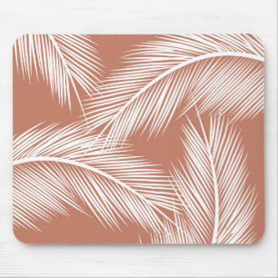 White palm leaves on terracotta colour background mouse pad