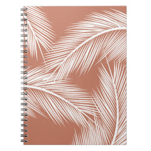 White palm leaves on terracotta colour background notebook