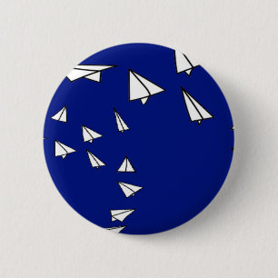 White paper planes on blue 2 inch round button