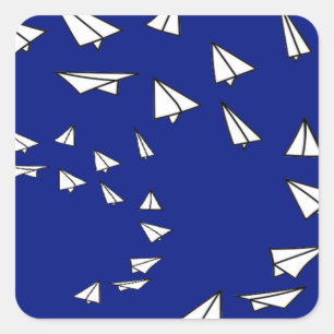 White paper planes on blue square sticker