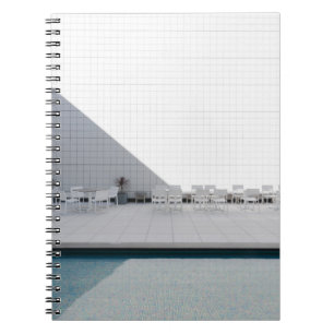 WHITE PATIO TABLE WITH CHAIRS DURING DAYTIME NOTEBOOK