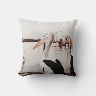 WHITE PELICAN ON BODY OF WATER DURING DAYTIME THROW PILLOW