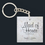 White Peonies Maid of Honour Wedding Favour Keychain<br><div class="desc">This beautiful keychain is perfect for thanking your Maid of Honour. Designed as a part of our White Reflections Wedding Suite, it features black text over a background of reflecting white flowers and hearts. The text is fully customizable and reads: Maid of Honour, with a place for her name, the...</div>