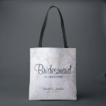 White Peony Flowers & Hearts Bridesmaid Wedding Tote Bag<br><div class="desc">This beautiful tote bag is perfect for thanking your bridesmaids. It features modern black script lettering over a background of reflecting white peony flowers and hearts. The text is fully customizable and reads: Bridesmaid, with a place for her name, the couple's names and wedding date. Perfect for filling with wedding...</div>