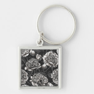 White peony flowers on dark grey keychain