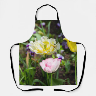 White, pink and yellow tulips in the garden     apron