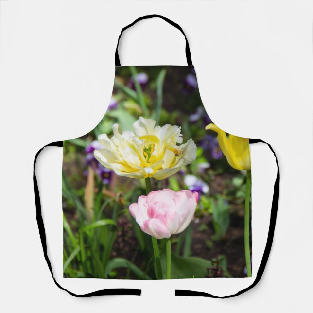 White, pink and yellow tulips in the garden     apron (Front)